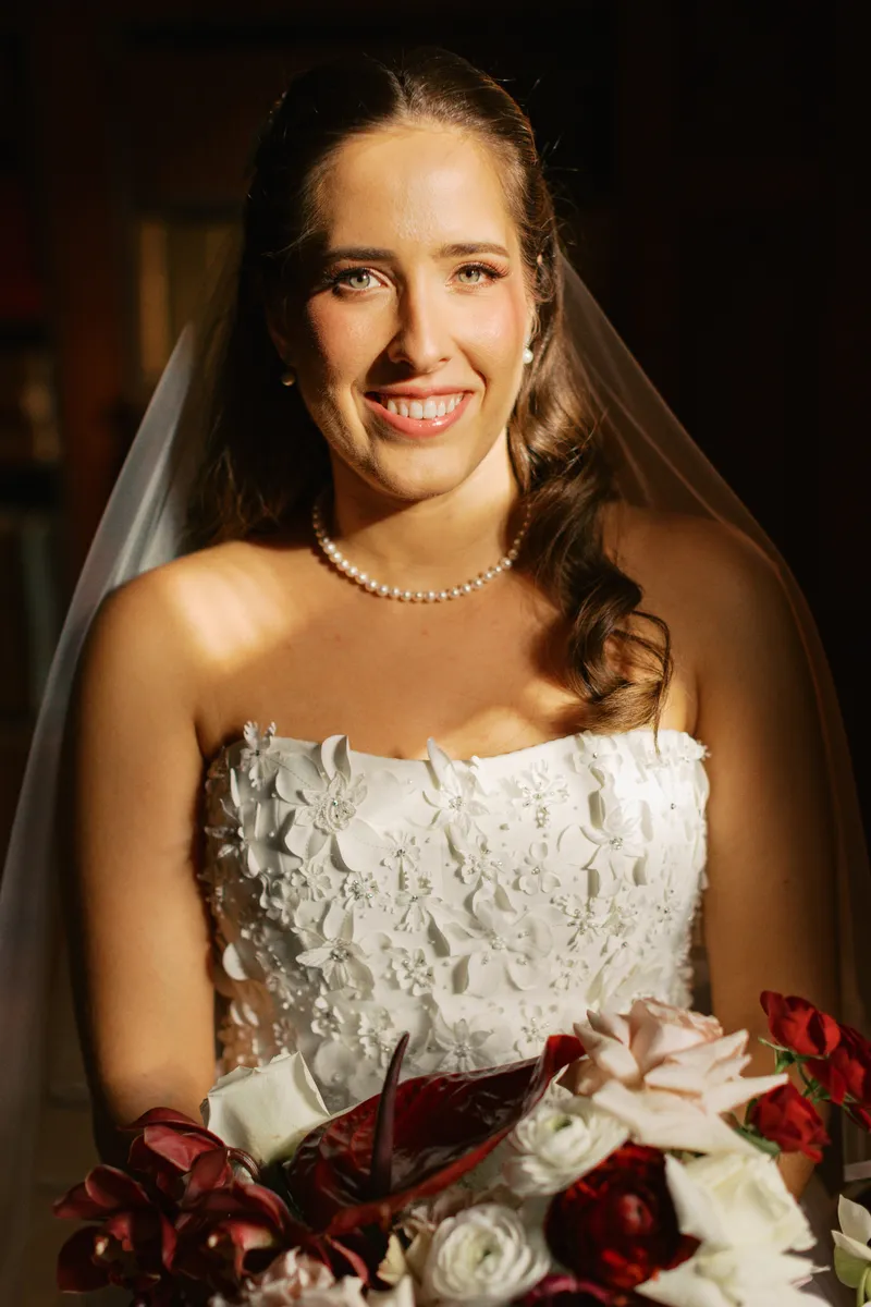 Smiling bride in a lace gown and veil, bridal hair and makeup by Arsh Sandhu Allure – Mississauga, Ontario