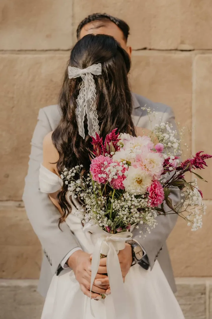Half-up bridal hairstyle with a lace bow, wedding hair by Arsh Sandhu Allure – GTA, Ontario