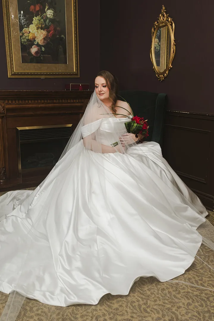 Bride in a satin ballgown with a soft veil, bridal hair and makeup by Arsh Sandhu Allure – Ontario