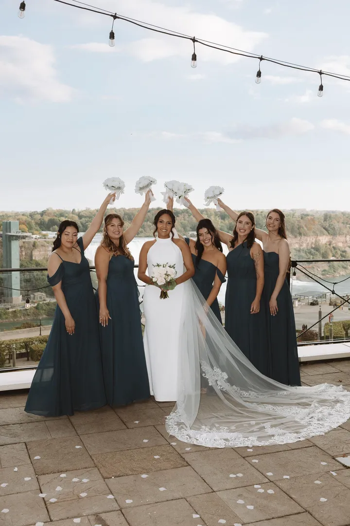 Bride with her bridesmaids on a rooftop, bridal party hair and makeup by Arsh Sandhu Allure – Niagara, Ontario